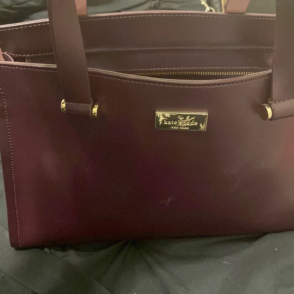 Burgundy Kate spade two strap bag. Used strap shows a little wear and tear.